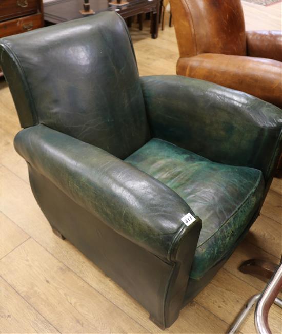 A 1930s French green leather armchair